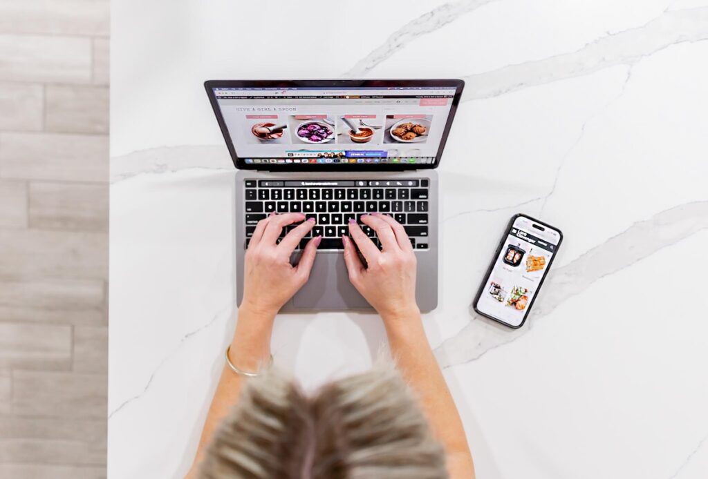 dietitian doing Telehealth nutrition counseling behind a laptop.